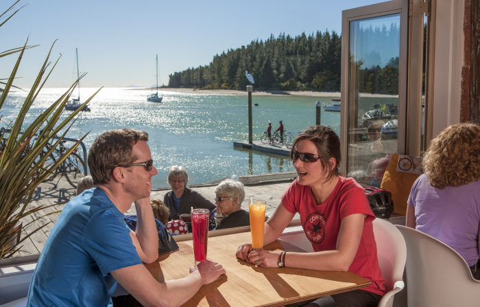 Photo of property: Some of Nelson's best restaurants/cafes on the Māpua Wharf, 4 minutes from The Gates Accommodation. Rabbit Island in background.